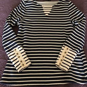 Woman’s navy and white striped top.